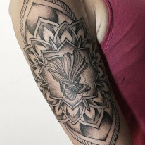 Mandala Japanese Fighting Fish bicep tattoo by tattoo artist Alan Lott at Sacred Mandala Studio in Durham, NC.